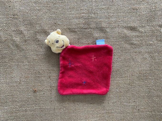 Doudou plat Winnie l'ourson rouge étoiles Disney d'occasion