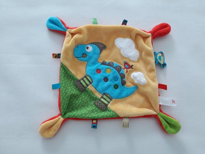 Doudou plat dinosaure rouge jaune bleu vert Nicotoy d'occasion